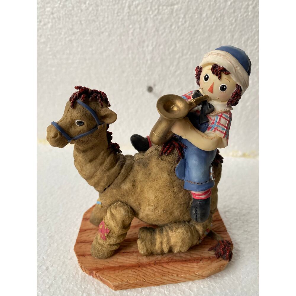 Enesco vintage Raggedy Andy on camel figurine Music Brings Friends Together"